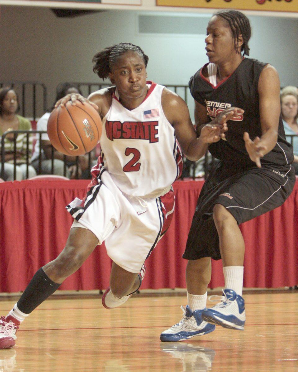 Nikitta Gartrell, a junior guard, drives down the court during an exhibition game in Reynolds Coliseum on Nov. 6. Gartrell scored 11 points and 6 rebounds. The women's basketball team beat out the Premier Players 59-53. Photo by Dreier Carr