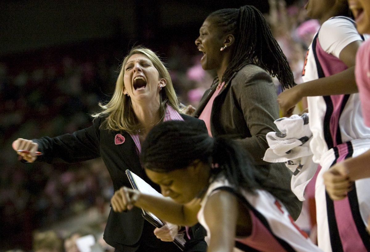 N.C. State women's basketball assistant coaches rejoice after a win over the University of Virginia. Photo by Dreier Carr