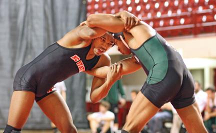 Sophomore Darrius Little tries to take control during a wrestling match in Reynolds Coliseum Sunday afternoon. The Pack lost 12-30 to Ohio.
