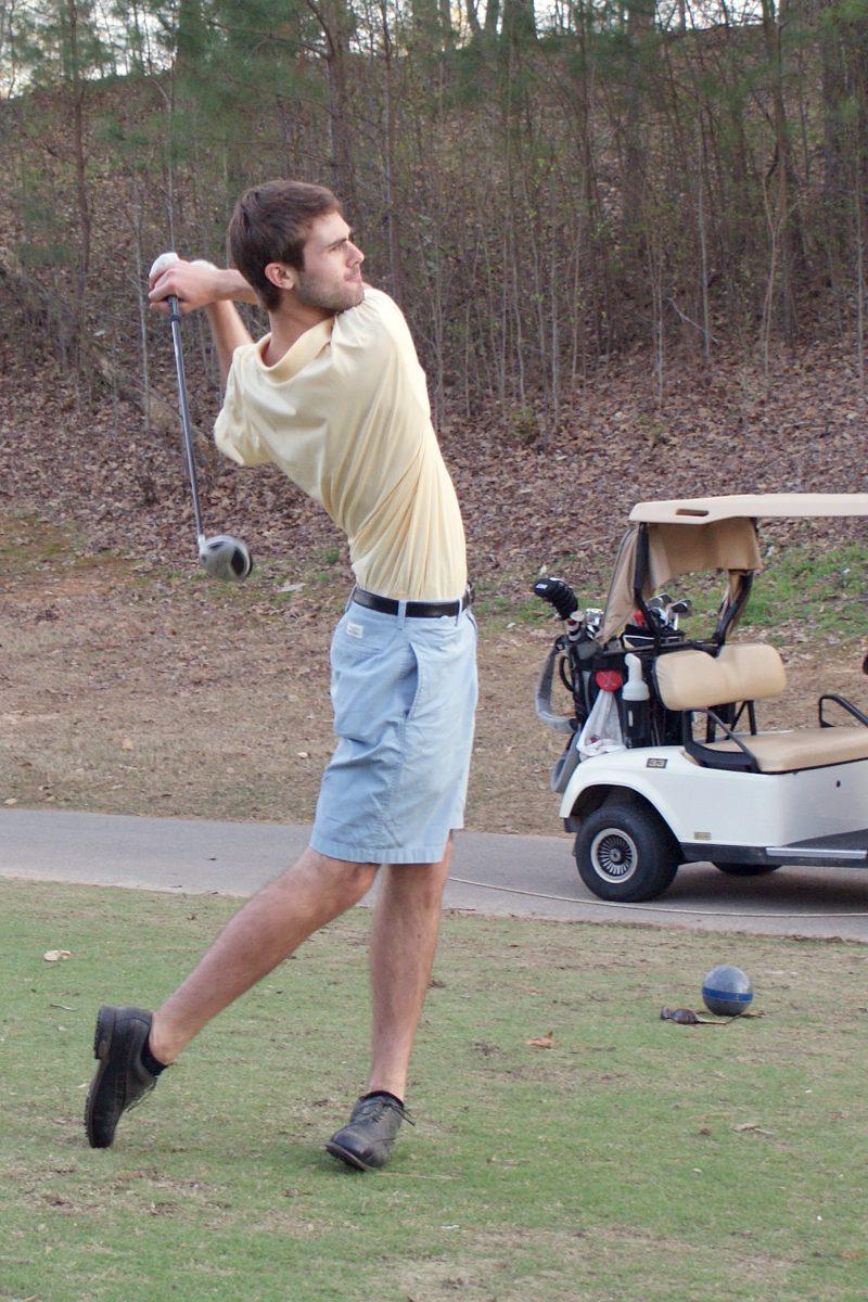 John Sanderson, a senior in biomedical engineering, tees off at the River Ridge Golf Club April 5. Freshman Rupe Taylor and Sanderson tied for the win with scores of 78, or six over par.