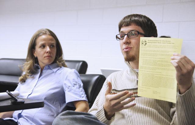 Students and Student Government members voice their concerns and opinions at the Student Government forum on the reconstruction of Talley Student Center. Kyle O&#8217;Donnell, a sophomore in nuclear engineering and representative for seniors in the College of Engineering, holds up &#8220;The Rationale Behind the Talley Decision&#8221; to convey how the decision is in the best interest for current and future students in regards to fees. Photo by Erica Heller
