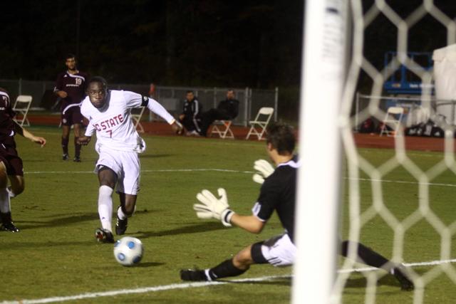 Redshirt senior forward Ronnie Bouemboue shoots the ball past Centenary goalkeeper Rennie Walker in the second half of the Oct. 27 game. Bouemboue had a goal and an assist in 60 minutes of play. The Pack beat the Gents 5-0. Photo by Brent Kitchen