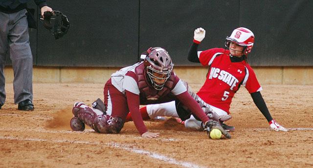 Sliding in to home, second basemen Landon Warren scores another run for the Wolfpack Wednesday evening. Warren scored four runs on the evening, setting a new school record, and helping the pack secure a 24-1 victory over the North Carolina Central Lady Eagles. Photo by Jordan Moore