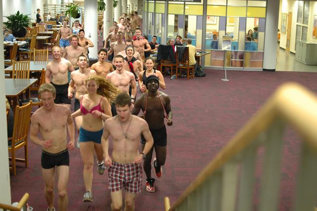 Students ran in "Nearly Naked Run" to donate old clothing to local homeless shelter and to have fun at the same time. Despite setbacks with weather and permits, a crowd of over 60 students showed up and preceeded to run in the D.H. Hill Library. Photo by Jordan Moore.