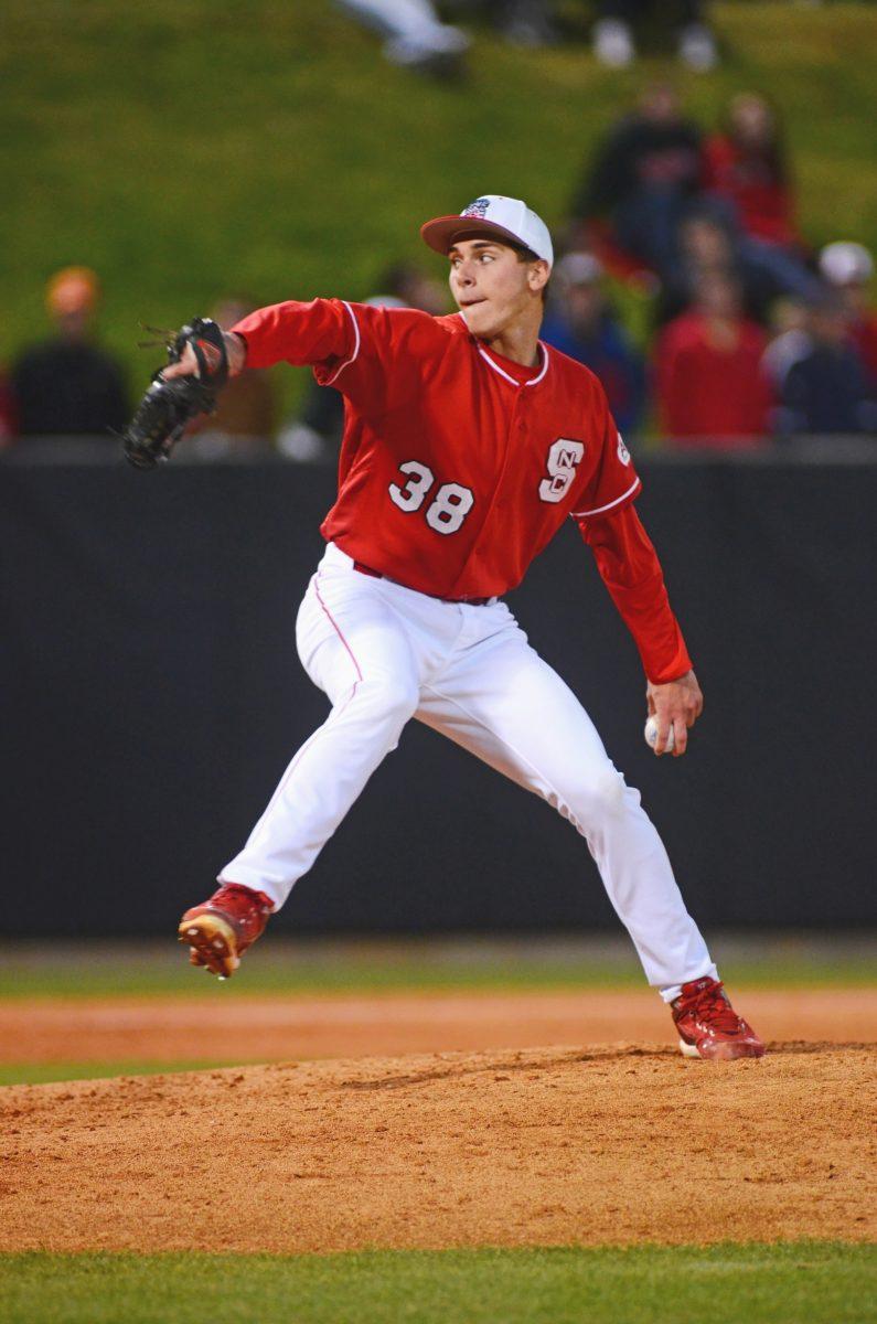 Freshman southpaw D.J. Thomas winds up before a pitch at Doak Field at Dail Park. Thomas, a native of Durham, has emerged as one of the Pack's most dependable relief pitchers.