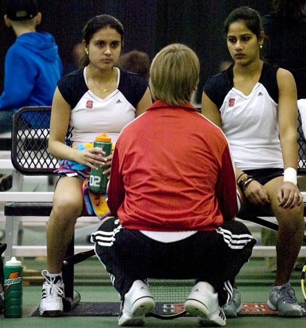 Sanaa Bhambri and Sandhya Nagaraj take advice from coach Hans Olsen during a match against CSU. Photo taken by Dreier Carr.