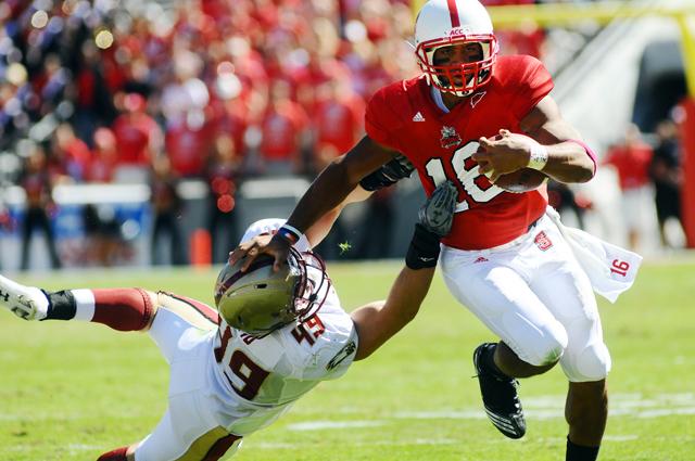 Redshirt junior quarterback Russell Wilson runs the ball during the Oct. 9 game against Boston College in Carter-Finely Stadium. Wilson had total of 45 rushing yards during the game. N.C. State won against Boston College, 44 - 17. Photo by Luis Zapata