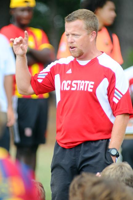 Coach Kelly Findley conducts his closing ceremony at the Wolfpack Boy's Soccer Camp. Findley takes over for George Tarantini after 29 years of service. Photo taken by Brent Kitchen.