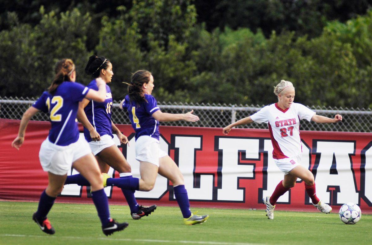 Freshman midfielder/forward Stephanie Bronson makes a play on the goal while fighting off three LSU defensive players during Monday&#8217;s game. Photo by Matt Nudi.