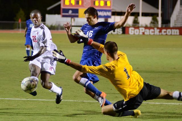 Freshman forward Zabarie Kollie takes a shot at goal, while two Presbyterian players attempt to block it on Tuesday, Sept. 20, 2011. Photo by John Joyner