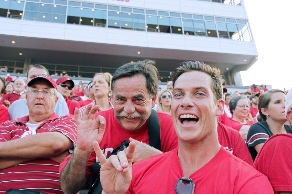 Miles McKirdy, a graduate student in business administration, enjoys his first college football game with his father, Mark. Photo contributed by Mark McKirdy.