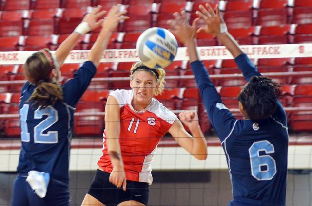Senior middle blocker Margaret Salata spikes the ball in the game against Citadel Sept. 17, 2011. Salata scored a team-high 14.5 points and 12 kills in the 3-0 win, extending the Wolfpack's win streak to 12.