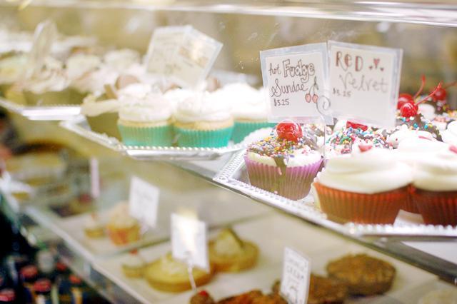 Rows of specialty cupcakes sit on display at Sugarland, a locally owned bakery on historic Franklin Street in Chapel Hill. Sugarland specializes in fresh Italian gelato, organic cakes made entirely from local ingredients, and custom-blended coffee and other beverages. Sugarland is expanding its business and opening a new dessert cafe in Raleigh's own Cameron Village. The new Sugarland location is slated to open early next year. Photo by Megan Farrell