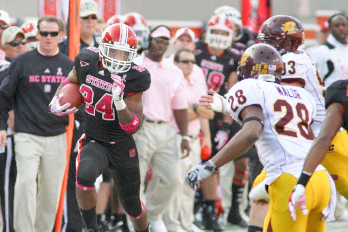 Junior halfback, James Washington, tries to run the ball for a touchdown during the second quarter of the N.C. State - Central Michigan football game at Carter-Finley Stadium on Saturday. Washington, one of three Floridians on State's active roster, has rushed for more than 100 yards in back-to-back games this season. Photo by Kevin Cook.