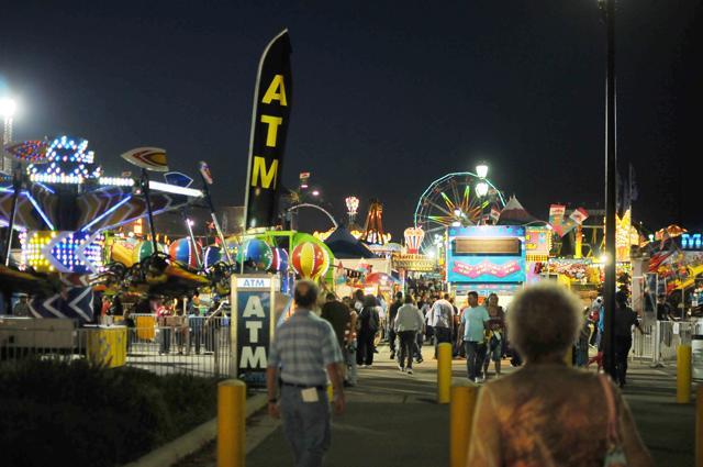 Rides, attractions, food stands, and fun houses light up at the annual State Fair, Thursday, Oct. 13, 2011. The fair is in Raleigh until next Friday, and is open from 8