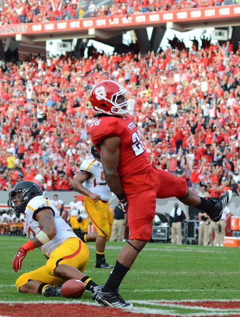 Redshirt freshman halfback Tony Creecy celebrates a touchdown during the victory over Maryland at Carter-Finley Stadium on Nov. 26. Photo by John Joyner.