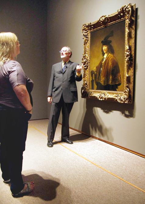 Touring the works he helped curate for the Rembrandt in America exhibit at the N.C. Museum of Art, Dennis Weller, curator of northern European art, explains to patrons the details of the Dutch painter Rembrandt van Rijn's life Thursday, Oct. 27, 2011. The Exhibit opened Sunday in the East building on the museum and features 30 autographed Rembrandt paintings from across America. Photo by Tim O'Brien.