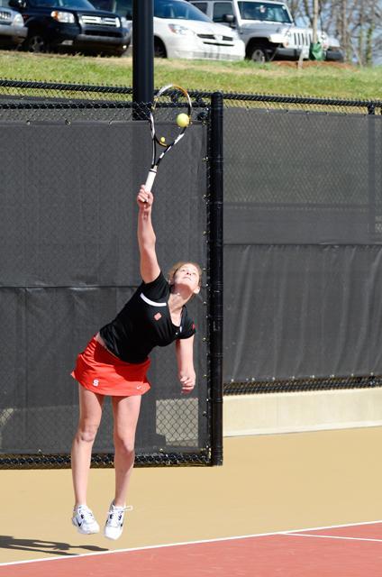 Senior Ashley Miller serves the ball during her doubles match against Wake Forest at the Dail Outdoor Tennis Stadium Sunday, Feb. 26. Photo by John Joyner.
