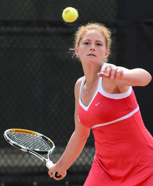 Senior Ashley Miller returns a volley during her singles match against Virginia Tech at the Curtis and Jacqueline Dail Outdoor Tennis Stadium Sunday, April 1. Photo by John Joyner.