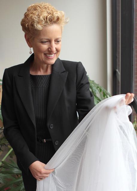 Marian McCord, associate professor of textile engineering science, chemistry and biomedical engineering, holds a mosquito net, a textile on which she has performed extensive research. Photo by Katherine Hoke