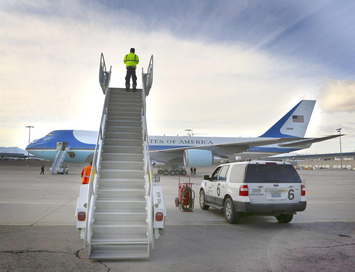 Ramp agent Weslee (CQ) Brown looks at Air Force One while parked at McCarran International Ariport Tuesday, Jan 29, 2013. President Obama unveiled his immigration reform proposal today during a speech at Del Sol High School.