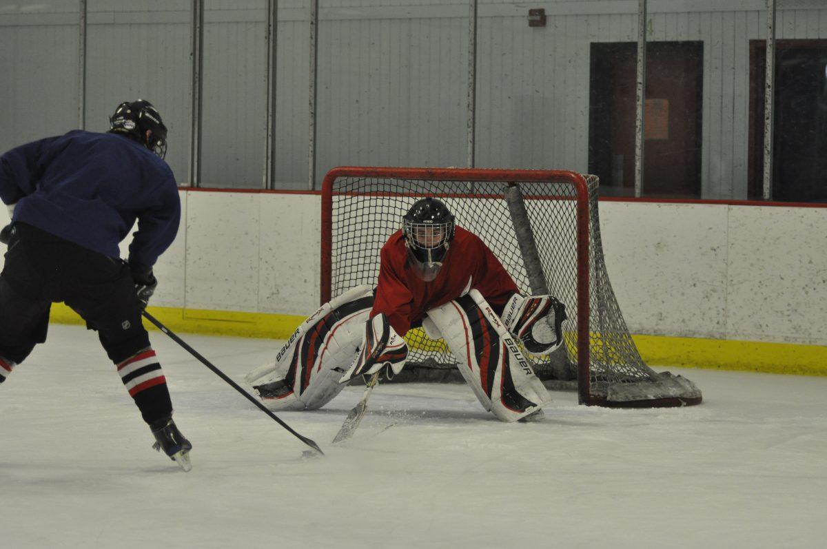 A member of the N.C. State club hockey team defends a goal during practice at Raleigh Center Ice. The team earned a 10-8 record this season in the Atlantic Coast Collegiate Hockey League. State won the ACCHL championship during the 2010-11 season.&#160;