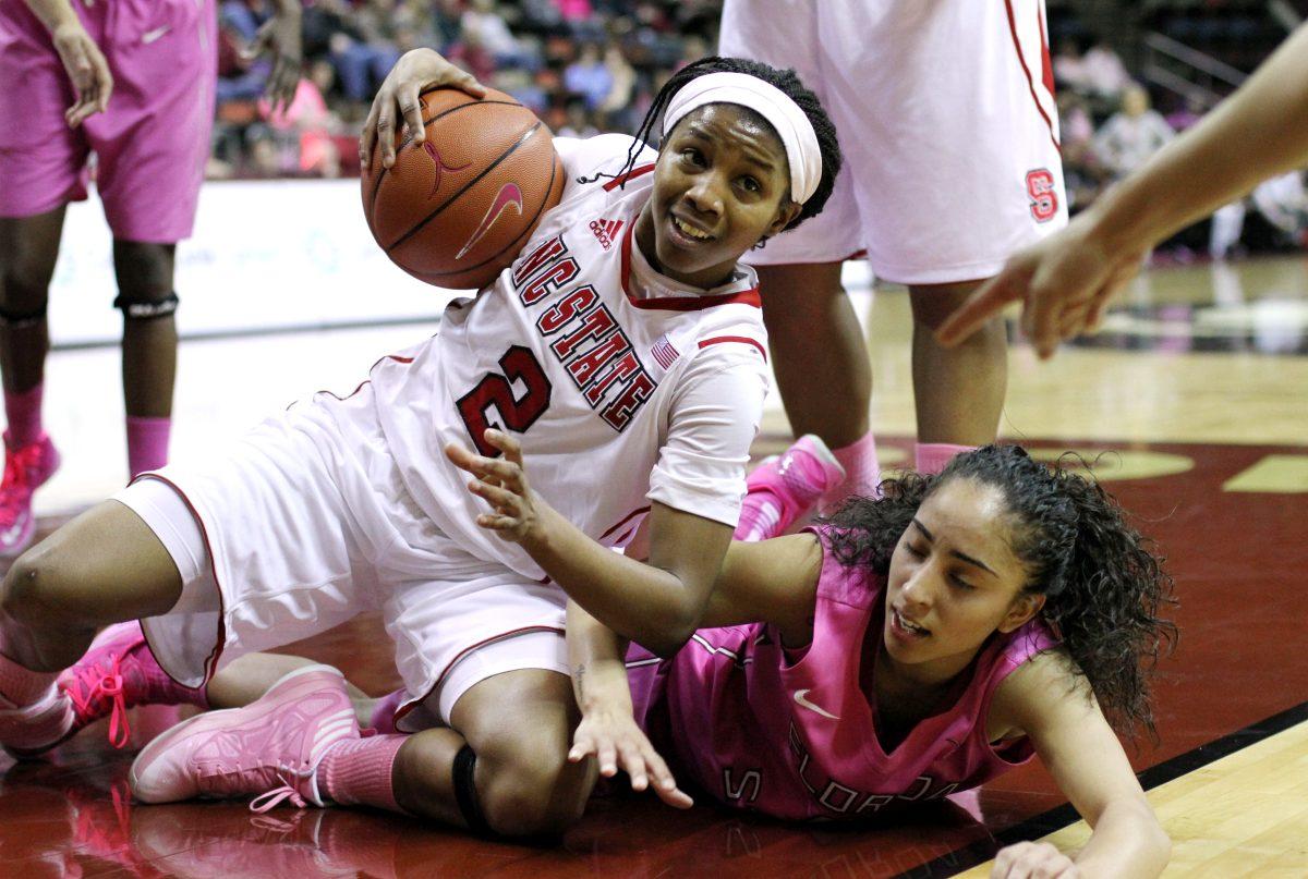NC State guard Len'Nique Brown (2) fights for possession against Florida State junior guard Yashira Delgado during the NC State women's basketball game on Thursday, Feb. 14, 2013. The Wolfpack defeated the Seminoles 76-69 in Tallahassee, FL.