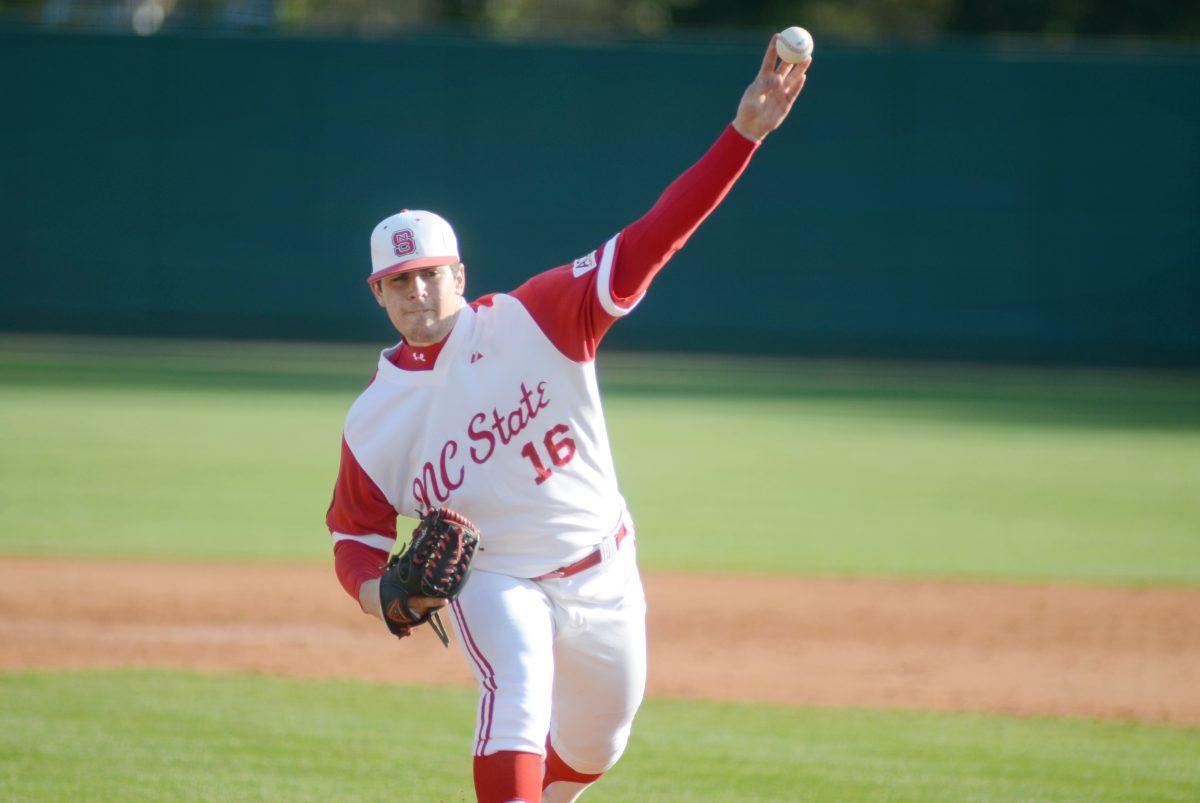 Pitching a fastball, freshman pitcher Carlos Rodon throws the ball down the center for a strike. Rodon pitched through the 5th inning in the Wolfpack's 10-0 win against UNCW Tuesday, February 21, 2012. Photo by Ryan Parry.