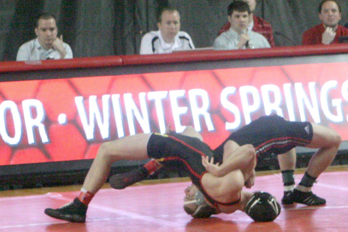 Junior Matt Nereim grapples his opponent from the University of Maryland. Photo by Moses Ifamose