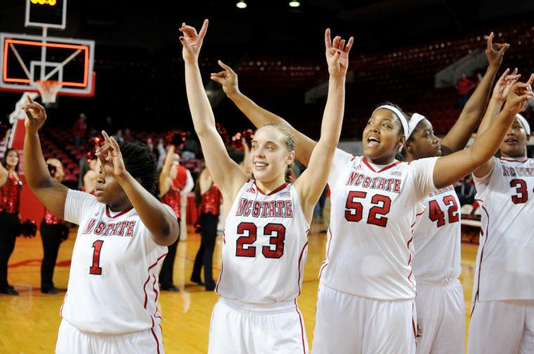 Senior guard Marissa Kastanek holds up her Wolfpack hands after the game against Virginia Thursday, Feb. 28, 2013. Kastanek had 14 points and 4 rebounds in the Wolfpack's 80-59 win over the Cavaliers at Reynolds Coliseum. Photo by Ryan Parry.