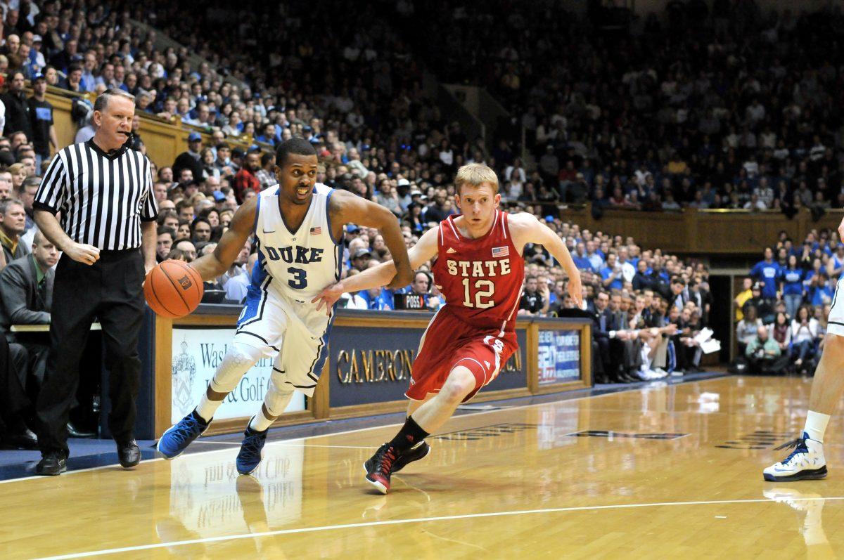 Tyler Thorton drives past freshman guard, Tyler Lewis, at Cameron indoor stadium on Thursday night.