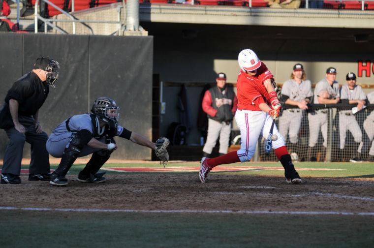 Junior second baseman Sam Morgan swings for a pop fly out against New Mexico State Wednesday, Feb. 27, 2013. The Wolfpack defeated the Aggies 9-2 at Doak Field at Dail Park. Photo by Ryan Parry.
