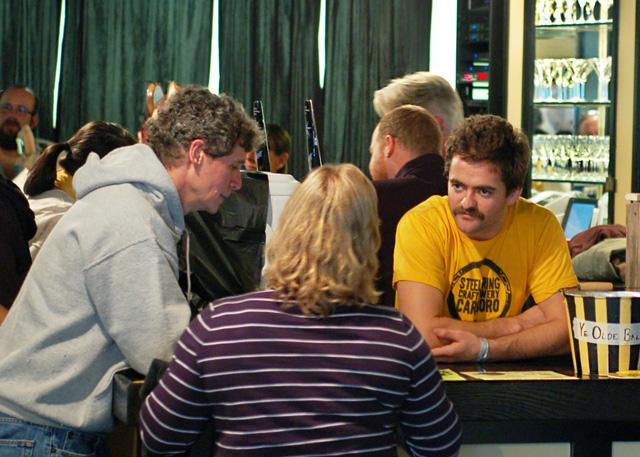 Maltais talking with two patrons at West End in Chapel Hill for the Homebrew for Hunger event. The event is an annual event to raise money for the hungry. Steel String Brewery is set to open March of this year in Carrboro.