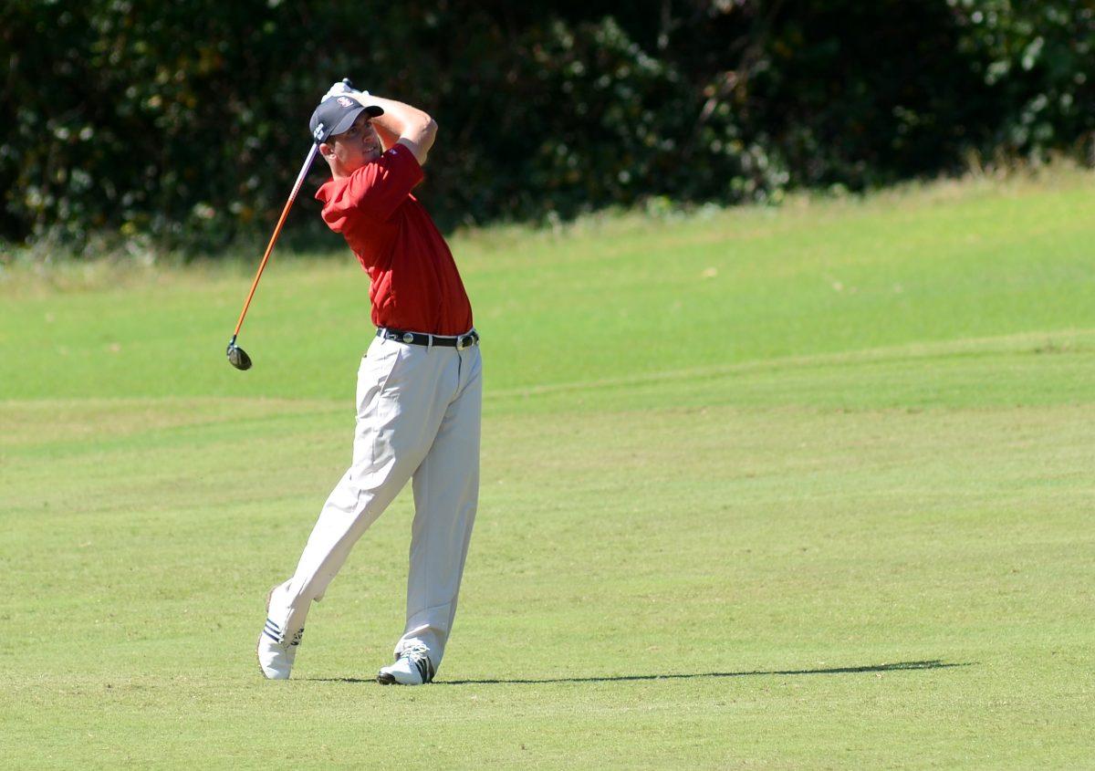 Senior Mitch Sutton hits the ball off the fairway of hole No. 7 at Duke University Golf Club. Sutton finished tied for 61st in the Rod Myers Invitational with a score of 20-under Sunday, Oct. 14, 2012. Photo by Ryan Parry.