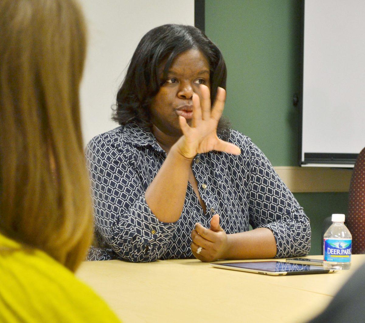 Associate Professor Dr. Blair Kelley leads a discussion on the struggles of African Americans Monday, March 18, in Withers Hall. Dr. Kelley presented the little known story of Corinne Sykes, a housemaid wrongfully accused of and executed for murder in the 1940s due to her race and social position. The talk was a part of the &#210;When Innocence Constitutes the Crime&#211; series, which will be running through Wednesday.