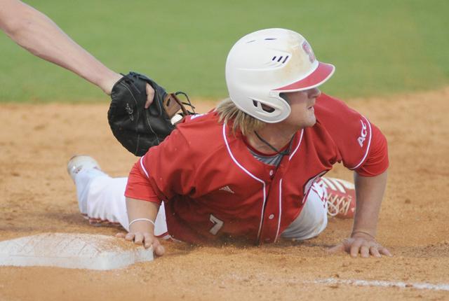 Senior shortstop Matt Bergquist slides back to first base on a check pitch by Quinnipiac Tuesday, March 12, 2013 at Doak Field at Dail Park. The Wolfpack were 4-0 all time against the Bobcats before Tuesday's game. Photo by Ryan Parry.