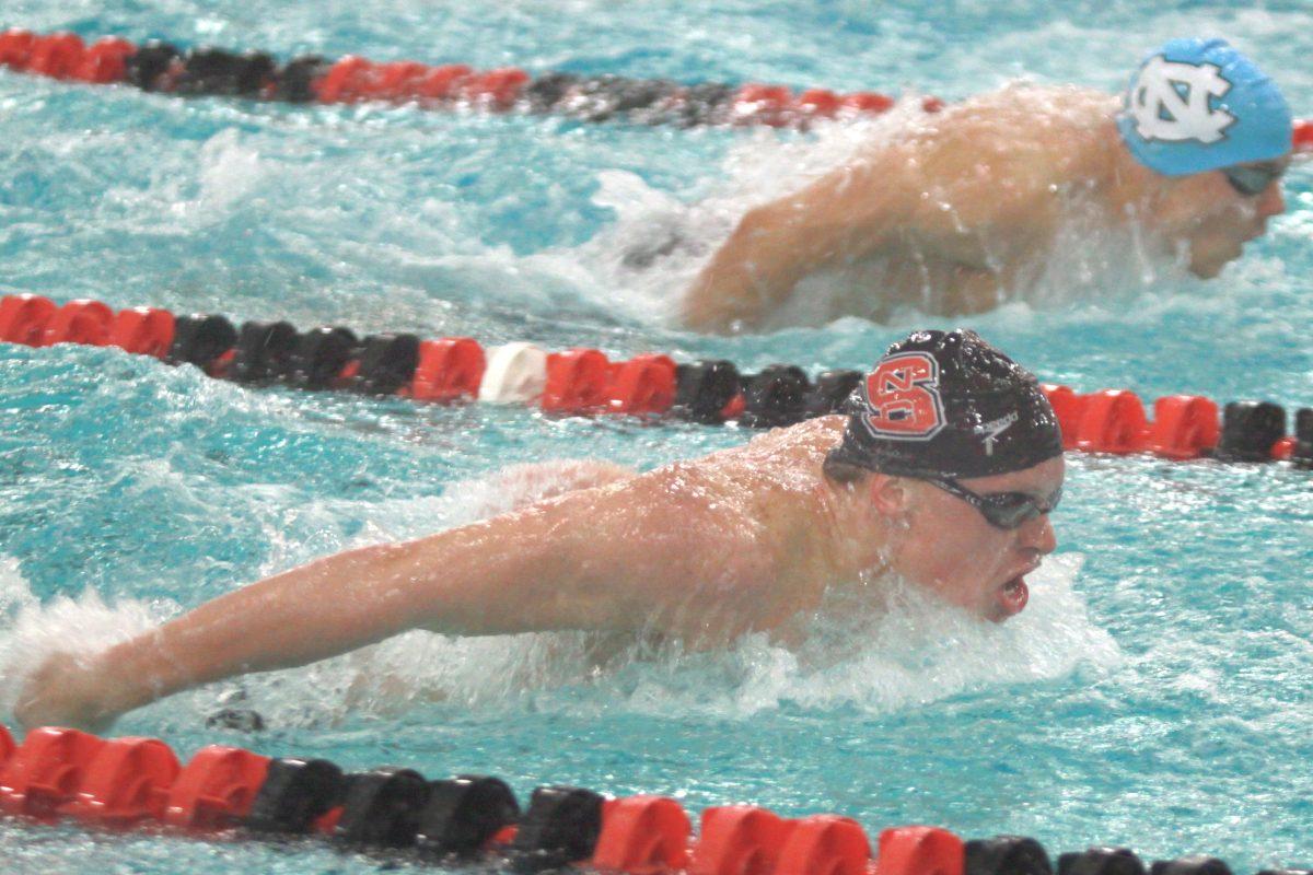 Photo by Joannah Irvin. Sophomore swimmer, Michael Camper, swims the butterfly stoke during the 400 yard individual medley against UNC-Chapel Hill on Saturday Feb. 2 2013. The Wolfpack men lost to the Tar Heels with a score of 159-140.&#160;