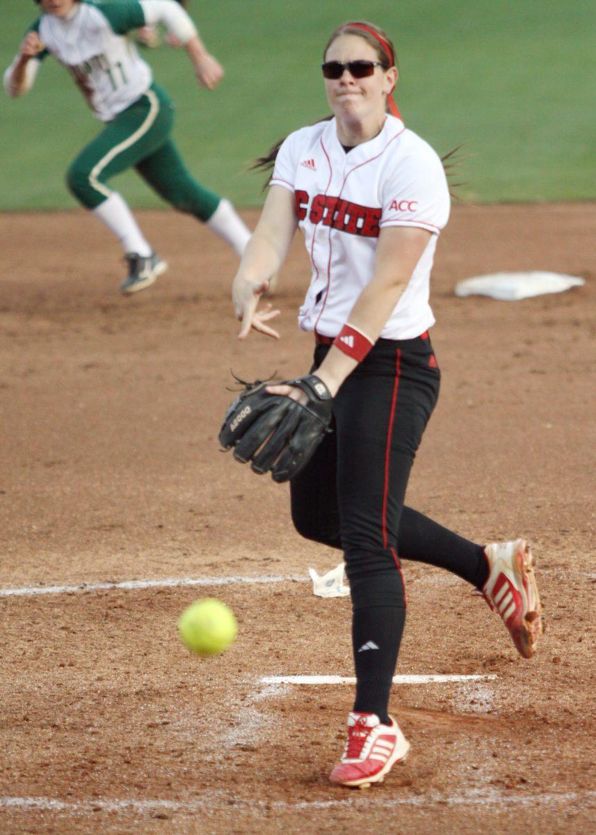 Sophomore pitcher Emily Weiman rockets a pitch towards the plate during second game of a double-header against UNC Charlotte April 3, 2013. The Wolfpack defeated the 49's 2-0 in game one and 10-3 in game two taking them to 17-16-1 on the season. Photo by Caide Wooten.