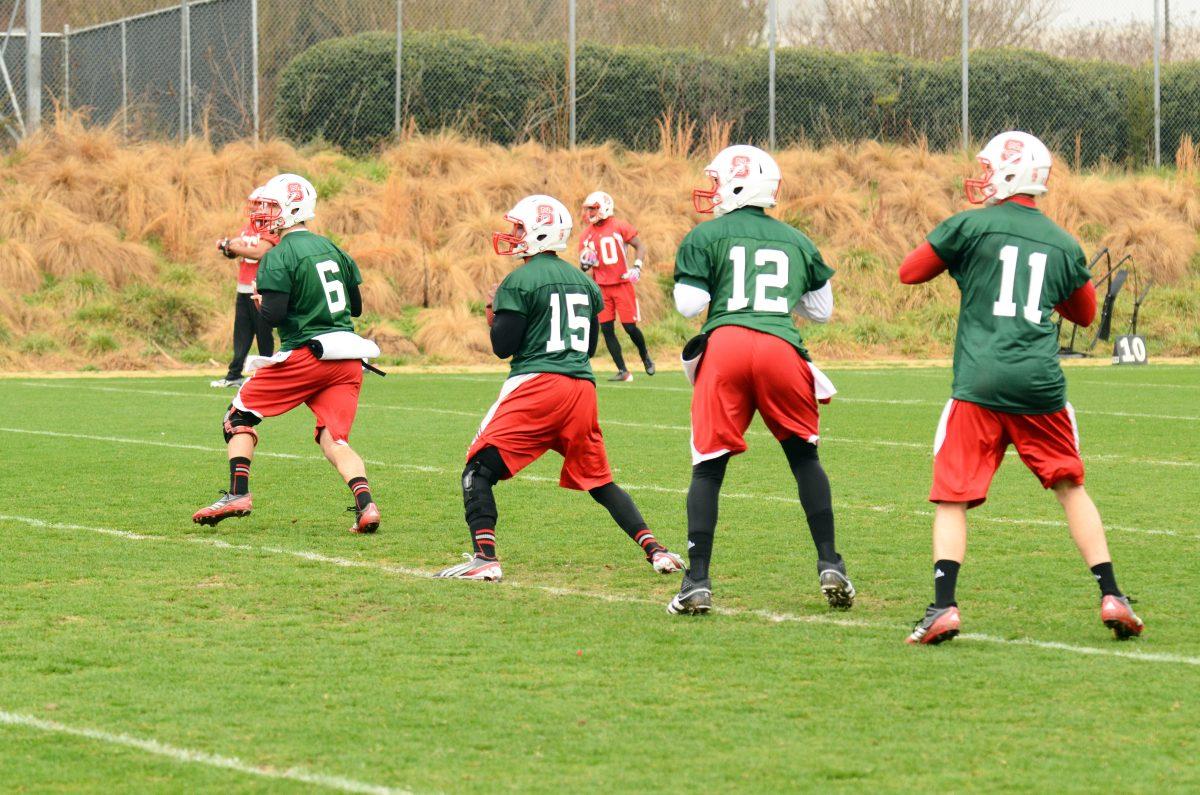 N.C. State's four quarterbacks, redshirt junior Pete Thomas, sophomore Manny Stocker, redshirt sophomore, and junior Jacoby Brissett take part in a drill during spring practice at the Dail Football Practice Complex Tuesday, March 19, 2013. Photo by John Joyner.