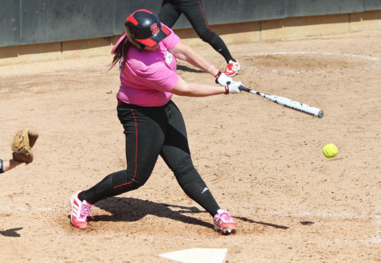 Freshman first baseman Hanna Sommer hits a ground ball against Maryland at Dail Softball Stadium April 6, 2013. The Wolfpack took the three-game weekend series 2-1, bringing their record to 5-6 in conference play and 19-17-1 overall. Photo by Caide Wooten.