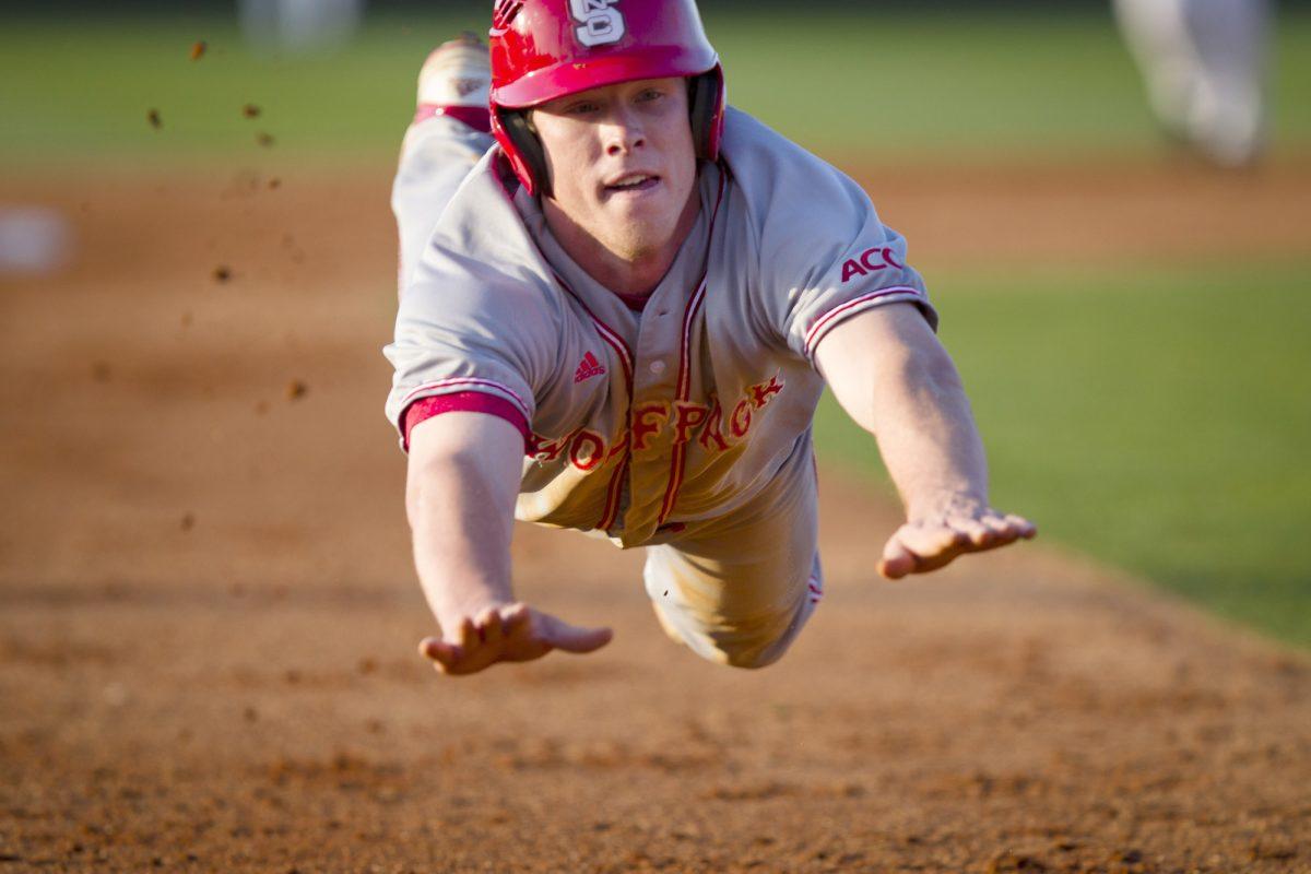 Brett Williams, senior outfielder, dives into third base at Lewis Field.&#160; The Wolfpack won the game 6-1 in Greenville.