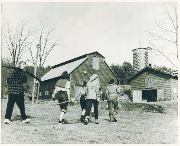 Students of Black Mountain College return to school barns after a day of&#160; farming.
