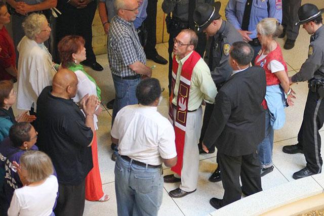 Some protestors in the General Assembly&#160; wore green wristbands, representing their willingness to get arrested.