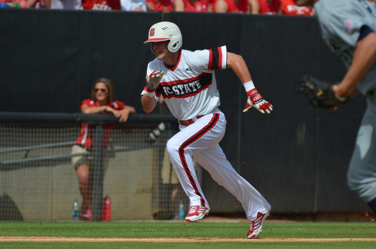 Junior right fielder Jake Fincher sprints from third to home during the first round of the Raleigh super regional against Rice on Doak Field Saturday June 8, 2013. The Wolfpack defeated the Owls, 4-3.&#160;