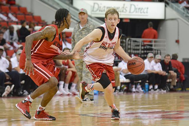 Sophomore guard Tyler Lewis drives around freshman guard Cat Barber during Primetime with the Pack in PNC Arena Friday, October 18, 2013. Photo by John Joyner.