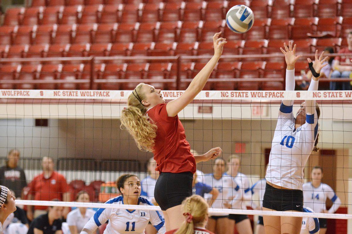 Senior middle blocker Meredith Richardson hits the ball across the net during the volleyball match against Duke in Reynolds Coliseum Sunday, Oct. 13, 2013. The Wolfpack beat the Blue Devils 3-1. Photo by John Joyner.
