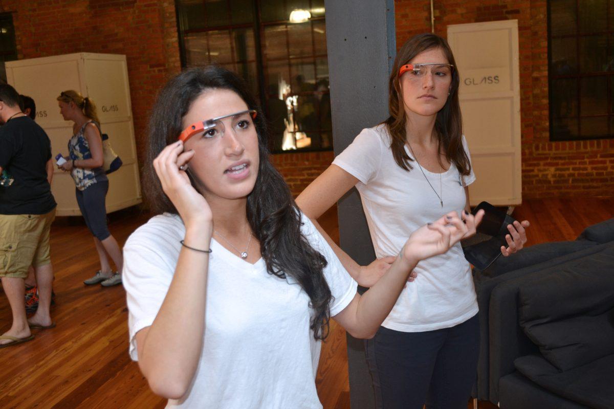 A Google Glass guide demonstrates to audience members how to use the different features Google Glass offers. Google began its cross-country tour of introducing the device to the general public at Bay 7 on the American Tobacco Campus in Durham Saturday.&#160;