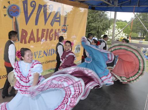 Young couples perform a traditional dane routine at Viva Raleigh, an annual event celebrating Hispanic heritage organized by the city of Raleigh.&#160;