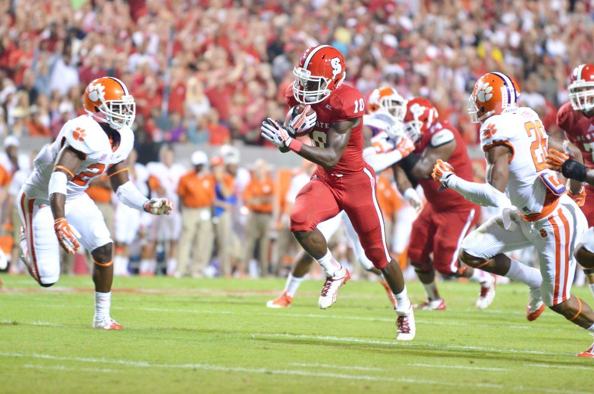 Sophomore running back Shadrach Thornton runs the football deep into Clemson territory during the game against the Tigers in Carter-Finley Stadium on Aug. 31. Clemson defeated the Wolfpack, 26-14. Photo by John Joyner.