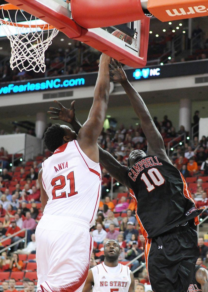 Freshman forward BeeJay Anya blocks Campbell senior forward Leek Leek's layup Saturday, Nov. 16, 2013. Anya had four rebounds and three blocks in the Wolfpack's 81-66 win over the Camels at PNC Arena. Photo by Ryan Parry.